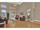 An open floor plan with a living room, dining room, and arched doorways at 1602 Oak Hollow Rd, Clermont, FL 34711