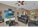 Cozy living room with modern entertainment center and comfortable seating area at 1602 Oak Hollow Rd, Clermont, FL 34711
