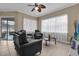 A comfortable living room with tile floors, bright windows, and stylish decor at 1602 Oak Hollow Rd, Clermont, FL 34711