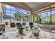 Enclosed sunroom filled with cozy seating and a view of the outdoors, perfect for relaxation at 1602 Oak Hollow Rd, Clermont, FL 34711