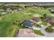 Aerial view of the golf community, green space, and the location of the home at 17126 Se 117Th Cir, Summerfield, FL 34491