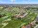 Aerial view of Stonecrest community highlighting lush green golf course and landscaping; the home location is marked at 17126 Se 117Th Cir, Summerfield, FL 34491