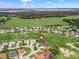 Aerial shot shows the home's location near the golf course and green spaces in the Stonecrest community at 17126 Se 117Th Cir, Summerfield, FL 34491