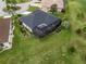 Aerial view of the home, landscaping, backyard and screened patio area at 17126 Se 117Th Cir, Summerfield, FL 34491