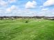 Community view of the houses backing up to a golf course and green space at 17126 Se 117Th Cir, Summerfield, FL 34491
