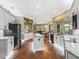 Bright kitchen featuring granite countertops, stainless steel appliances, and a large island at 17126 Se 117Th Cir, Summerfield, FL 34491