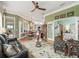 Open floor plan living room with hardwood floors and view to dining room and kitchen at 17126 Se 117Th Cir, Summerfield, FL 34491
