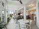 Bright sunroom features seating and dining areas, lots of windows and natural light at 17126 Se 117Th Cir, Summerfield, FL 34491