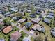 Aerial view of single story home with mature landscaping and in a quiet residential neighborhood at 17694 Se 88Th Covington Cir, The Villages, FL 32162