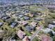 Aerial view of home in a neighborhood on a golf course at 17694 Se 88Th Covington Cir, The Villages, FL 32162