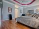 Comfortable bedroom with hardwood floors and a classic dresser at 17694 Se 88Th Covington Cir, The Villages, FL 32162