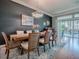 Open dining area with sliding glass doors to the patio and stylish decor at 17694 Se 88Th Covington Cir, The Villages, FL 32162