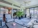 Inviting patio with comfortable seating and a decorative rug, perfect for relaxation at 17694 Se 88Th Covington Cir, The Villages, FL 32162