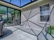Covered patio with concrete flooring, access to interior, and large window at 17694 Se 88Th Covington Cir, The Villages, FL 32162