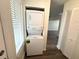 Laundry closet with stacked washer and dryer at 18203 Sandalwood Dr # 18203, Wildwood, FL 34785