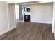 Open living room view to the kitchen featuring stainless appliances at 18203 Sandalwood Dr # 18203, Wildwood, FL 34785