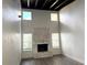 Vaulted living room with fireplace, decorative stone, and modern flooring at 18203 Sandalwood Dr # 18203, Wildwood, FL 34785