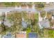An aerial view showing the backyard pool and mature trees on the property at 1840 12Th St, Clermont, FL 34711