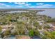 An aerial view features mature trees with backyard pool at 1840 12Th St, Clermont, FL 34711