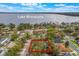 Aerial view featuring mature trees in a lakeside community at 1840 12Th St, Clermont, FL 34711