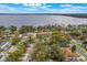 Aerial view showing a lakeside community with mature trees at 1840 12Th St, Clermont, FL 34711