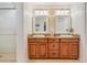 Spacious bathroom with double vanities, updated lighting and walk-in shower at 1840 12Th St, Clermont, FL 34711