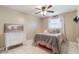 Bright bedroom with tile floor, white dresser and a picture of cows on the wall at 1840 12Th St, Clermont, FL 34711