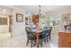Inviting dining room featuring a wood table, black chairs, and natural light from the windows at 1840 12Th St, Clermont, FL 34711