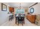Bright dining room with a wooden table, seating for six, and a view of the kitchen at 1840 12Th St, Clermont, FL 34711