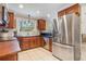 Well-lit kitchen with stainless steel appliances, granite counters and plenty of cabinet space at 1840 12Th St, Clermont, FL 34711