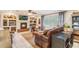 Warm and inviting living space features a fireplace, tile flooring, and comfortable seating, perfect for entertaining guests at 1840 12Th St, Clermont, FL 34711