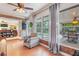 Bright sunroom offering views of the pool and outdoor living, featuring brick accents at 1840 12Th St, Clermont, FL 34711