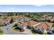 Aerial view of a residential neighborhood showcasing well-maintained homes, landscaping and street layout at 1923 Greeleyville Ter, The Villages, FL 32162