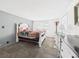 Cozy bedroom featuring carpet flooring, a neutral color scheme, and natural light to create a serene atmosphere at 2 Heather Ln, Fruitland Park, FL 34731