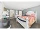 Cozy bedroom featuring neutral walls and a bed with patriotic-themed bedding at 2 Heather Ln, Fruitland Park, FL 34731