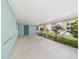 Large covered carport with a convenient side entrance and lush landscaped border for added curb appeal at 2 Heather Ln, Fruitland Park, FL 34731