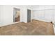 Spacious living room with natural lighting and doors to an adjacent room at 2 Heather Ln, Fruitland Park, FL 34731