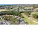 Wide aerial view showcases this golf community, highlighting the course and the homes nestled within it at 2065 Braxton St, Clermont, FL 34711
