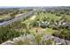 Stunning aerial view of a home located near a golf course and highway at 2065 Braxton St, Clermont, FL 34711
