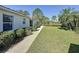 View of the backyard with a well-maintained lawn and mature landscaping, enhancing its curb appeal at 2065 Braxton St, Clermont, FL 34711