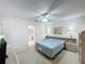 Cozy bedroom features neutral carpet and two bedside tables with lamps for a peaceful retreat at 2065 Braxton St, Clermont, FL 34711
