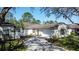 Charming single-story home with a two-car garage, landscaped front yard, and inviting curb appeal at 2065 Braxton St, Clermont, FL 34711