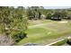 Scenic golf course view features lush green fairways, mature trees, and manicured landscaping at 2065 Braxton St, Clermont, FL 34711