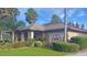 Charming golf club with well-kept lawns and palm trees at 21410 Royal St Georges Ln, Leesburg, FL 34748