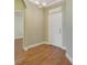 Inviting entryway with tiled flooring, a chandelier, and a white front door, offering a warm welcome at 22027 Belgian Ct, Mount Dora, FL 32757