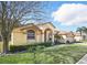Well-maintained front yard with lush green lawn and mature landscaping at 2471 Holly Berry Cir, Clermont, FL 34711