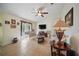 Cozy living room with ceiling fan, tile floors, and access to the exterior at 2471 Holly Berry Cir, Clermont, FL 34711