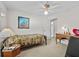 Bedroom featuring a bed with a horse blanket and a ceiling fan at 25013 Adair Ave, Sorrento, FL 32776