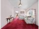 Inviting living room with warm carpeting, stylish furniture, and sunlit windows at 25013 Adair Ave, Sorrento, FL 32776
