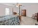 Warm main bedroom with ample space, ceiling fan, and traditional furnishings at 25013 Adair Ave, Sorrento, FL 32776